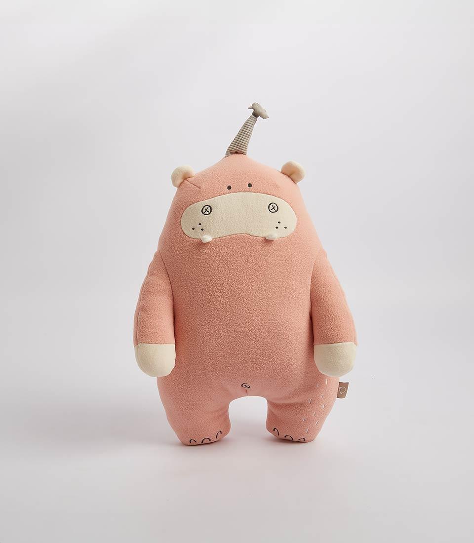 Soft peach plush hippo toy with cream snout and striped horn, ideal for kids and babies
