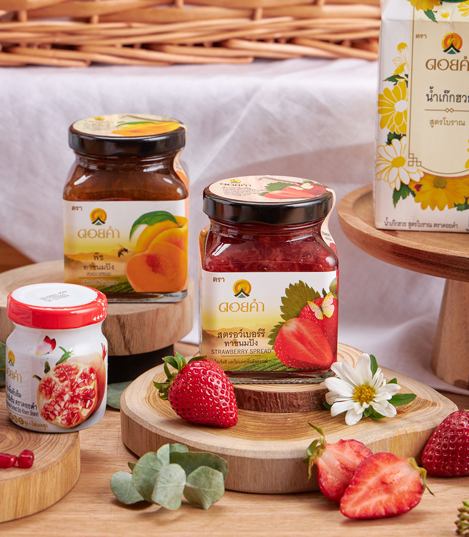 Premium wellness gift basket with fruit spreads, honey, and herbal beverages on wooden display