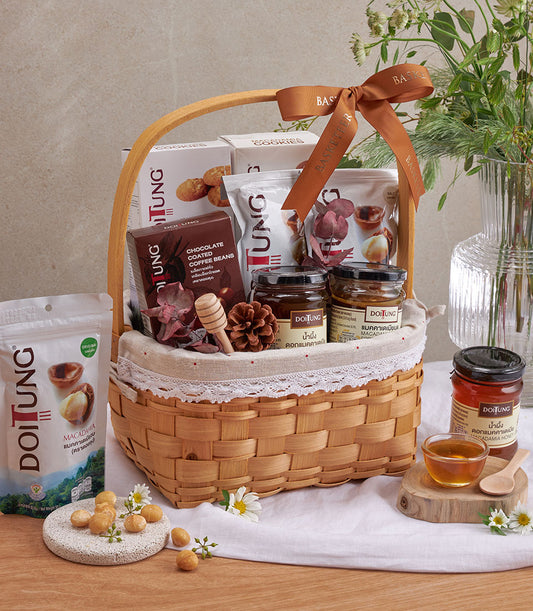 Woven gift basket with DoiTung macadamia nuts, honey, chocolate coffee beans, and premium gourmet treats