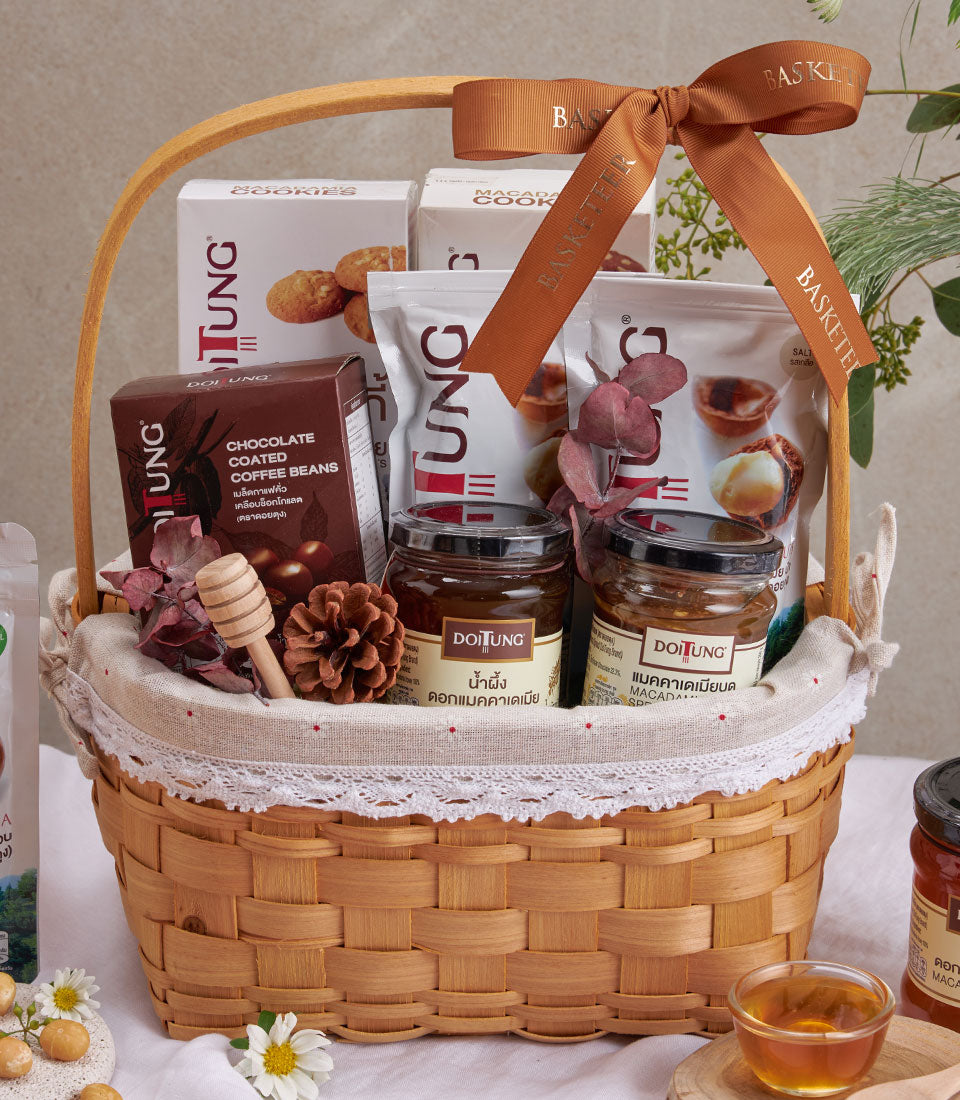 Premium macadamia and honey gourmet gift basket with woven wicker, chocolate coffee beans, and DoiTung artisan products