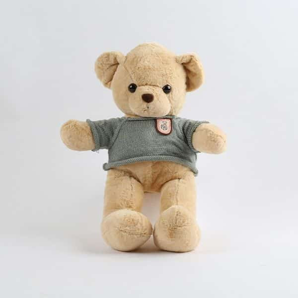 Soft plush teddy bear wearing cozy grey knitted sweater, perfect gift for children and collectors