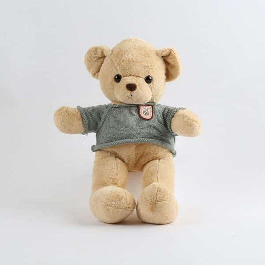 Soft plush teddy bear wearing cozy grey knitted sweater, perfect gift for children and collectors