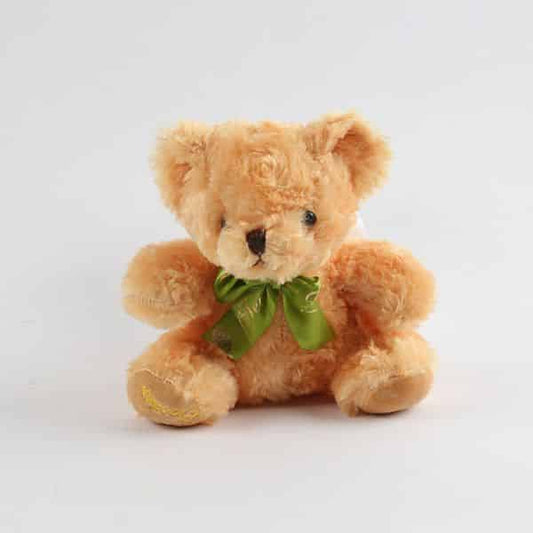 Light brown fluffy teddy bear with green satin ribbon bow, perfect for gift hampers and celebrations