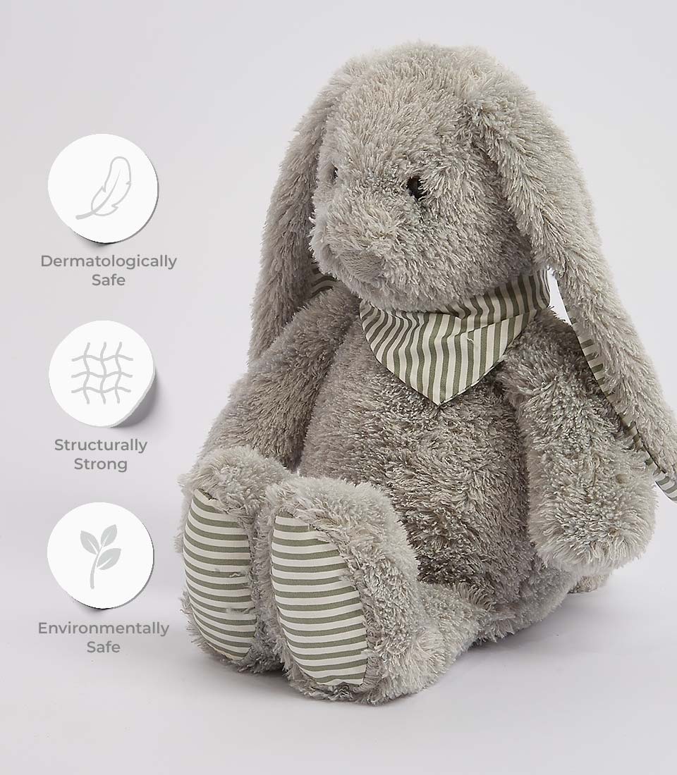 Soft, cuddly gray plush bunny with striped bandana. A charming addition to any Basketeer baby gift hamper.