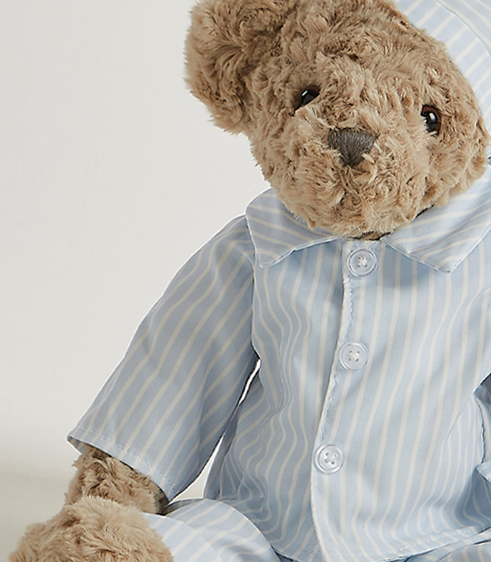 Basketeer plush teddy bear gift in light blue striped pajamas and matching nightcap. The perfect Bangkok gift for baby or get well soon.