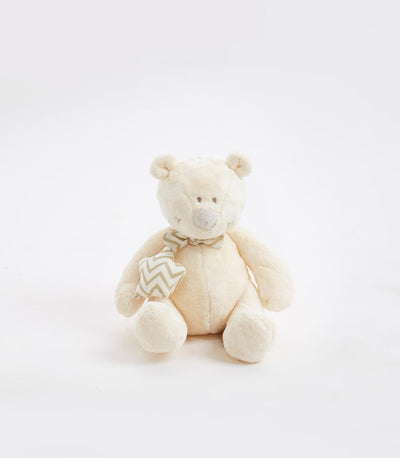 Cream plush teddy bear with chevron-patterned bow tie and star toy, perfect for baby gifts