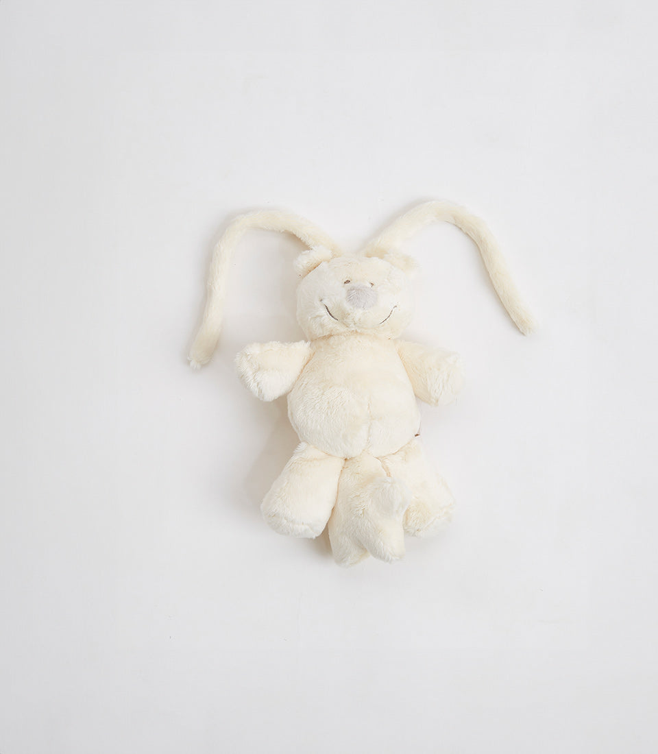 Cream plush teddy bear with floppy ears and hanging loop, perfect for baby gifts