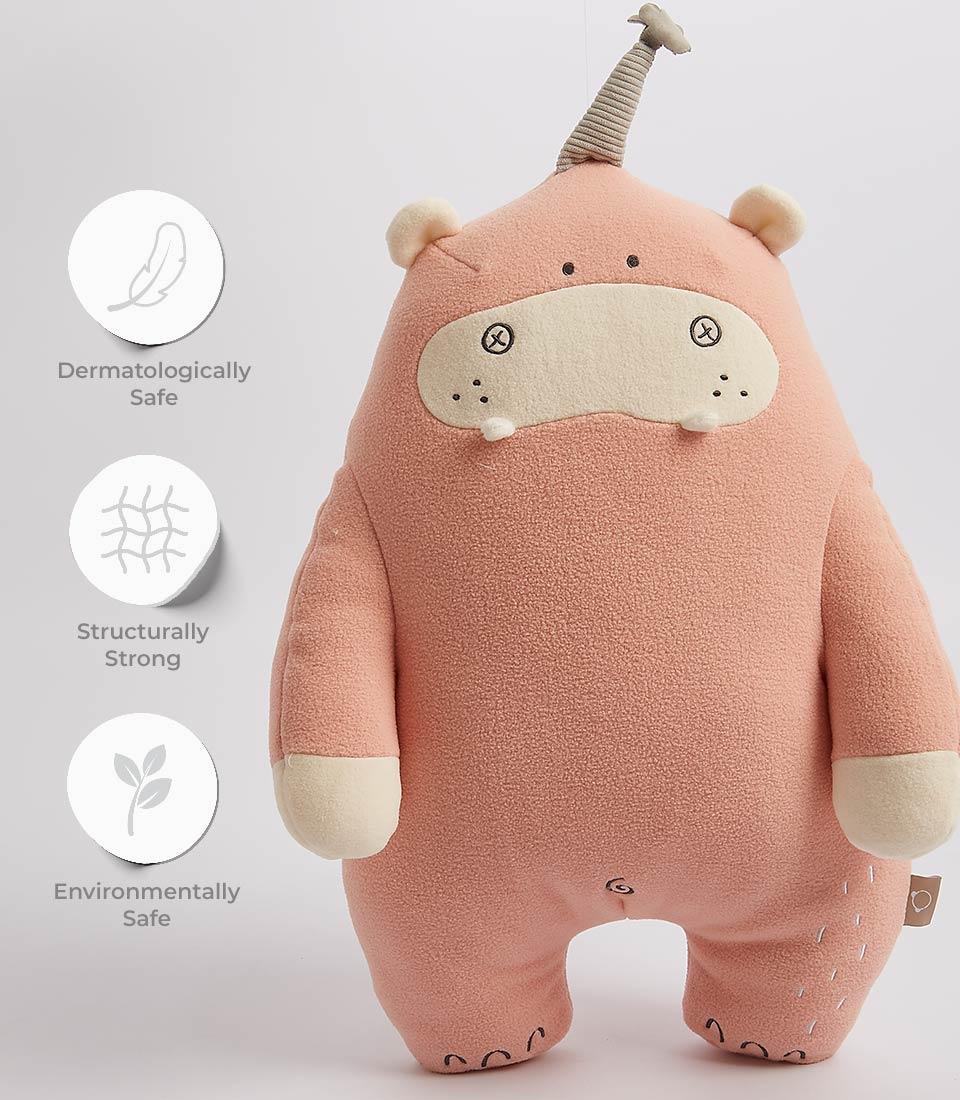 Soft pink plush hippo toy with cream accents and embroidered features for kids