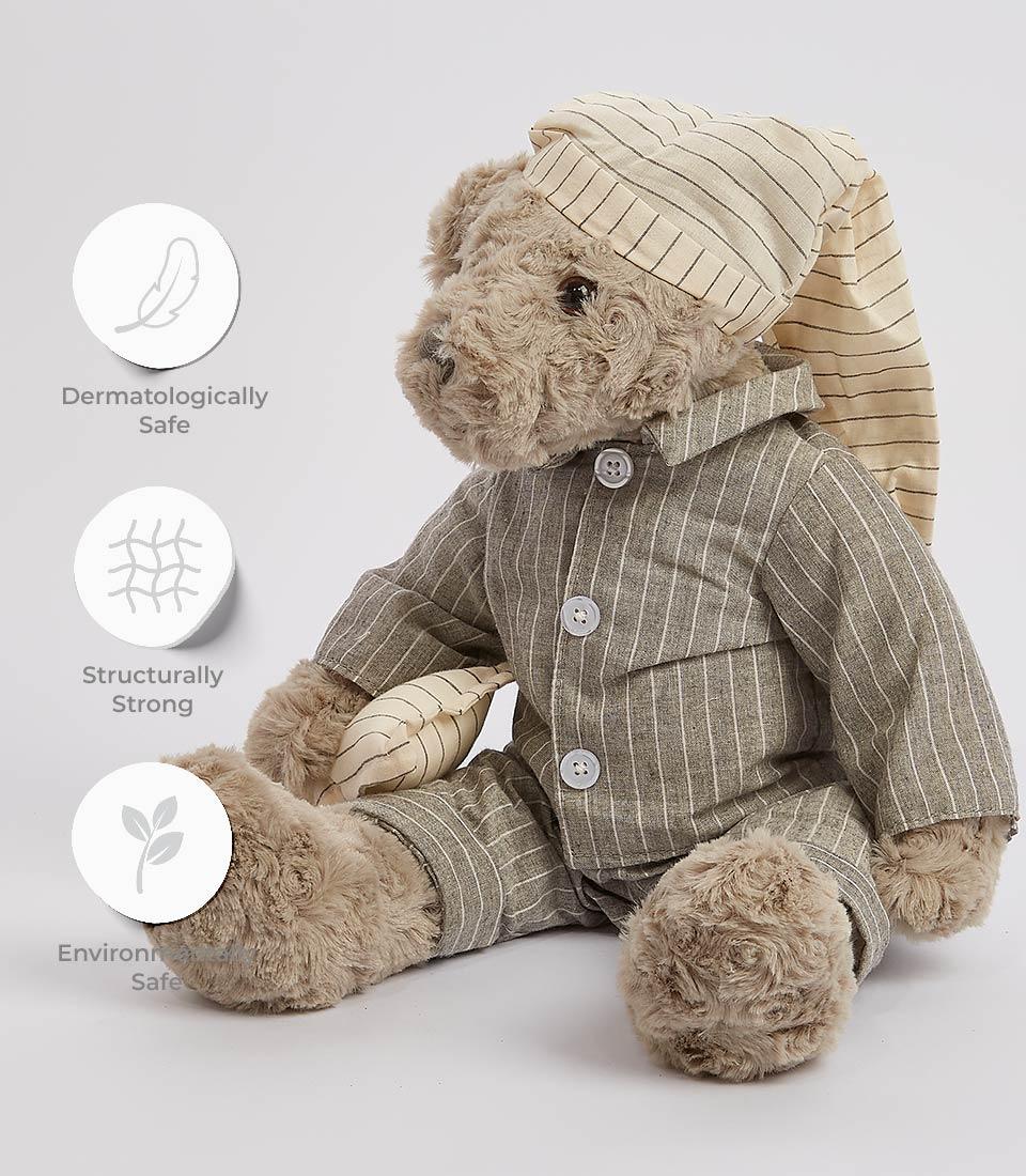 Soft plush teddy bear in striped pajamas and nightcap, dermatologically safe for kids
