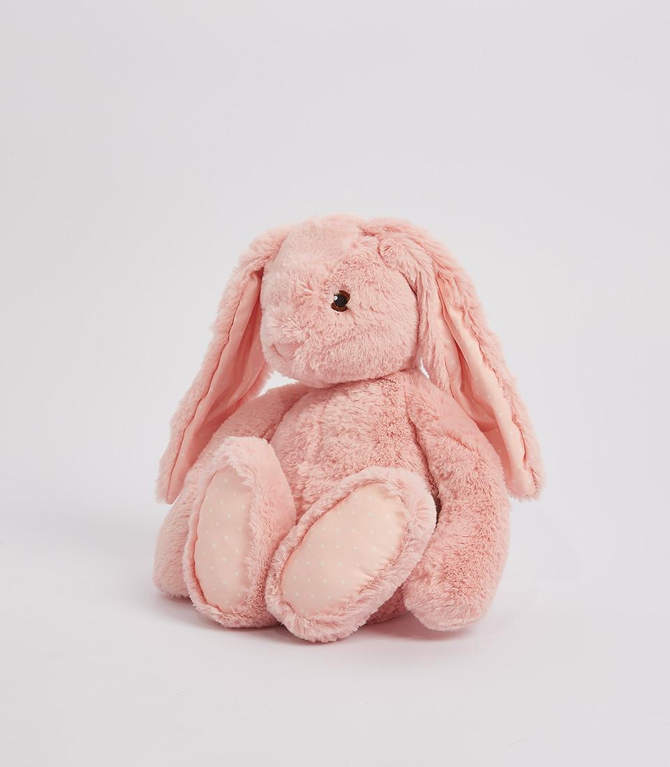 Soft pink plush bunny with floppy ears and polka-dot accents for babies and kids