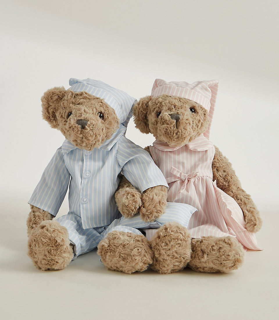 Soft plush teddy bear pair in blue and pink striped pajamas with matching sleep caps and pillow