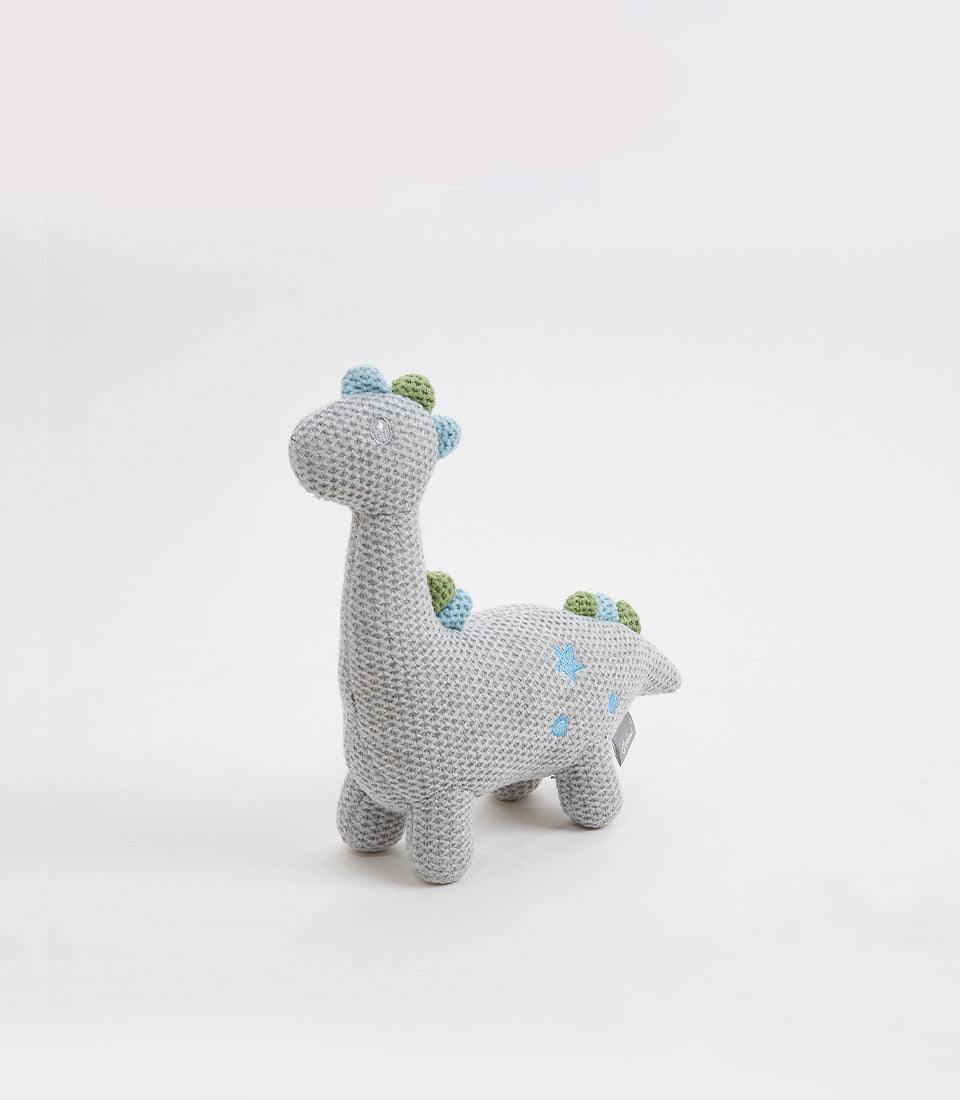 Handcrafted crocheted grey dinosaur soft toy with light blue and green details for babies and kids
