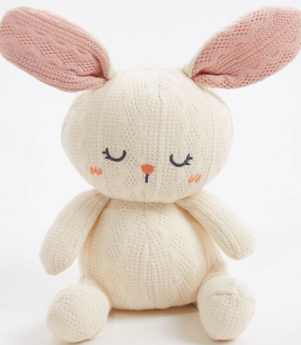 Cream handcrafted crocheted bunny with pink ears and embroidered features, soft toy for babies and children