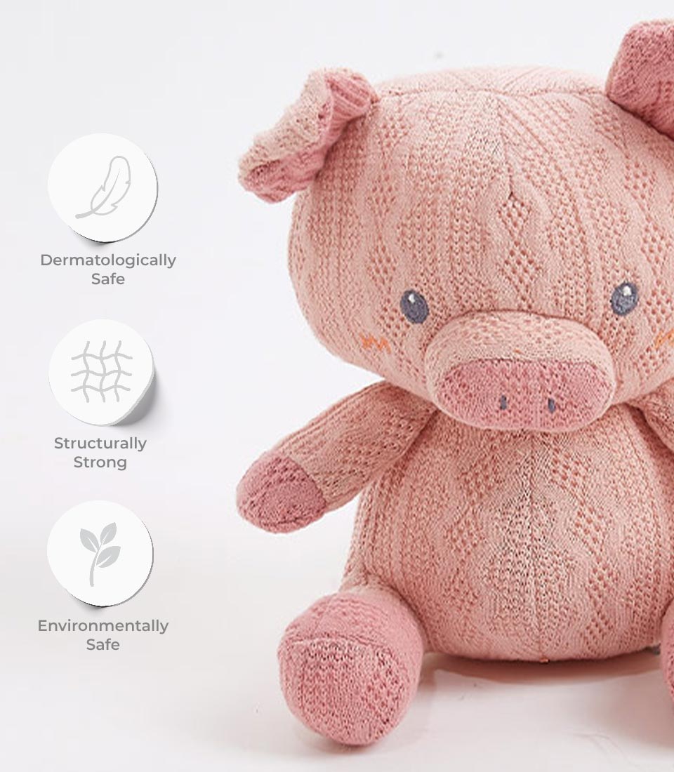 Pink handcrafted crocheted pig plush toy with textured knit pattern and embroidered details