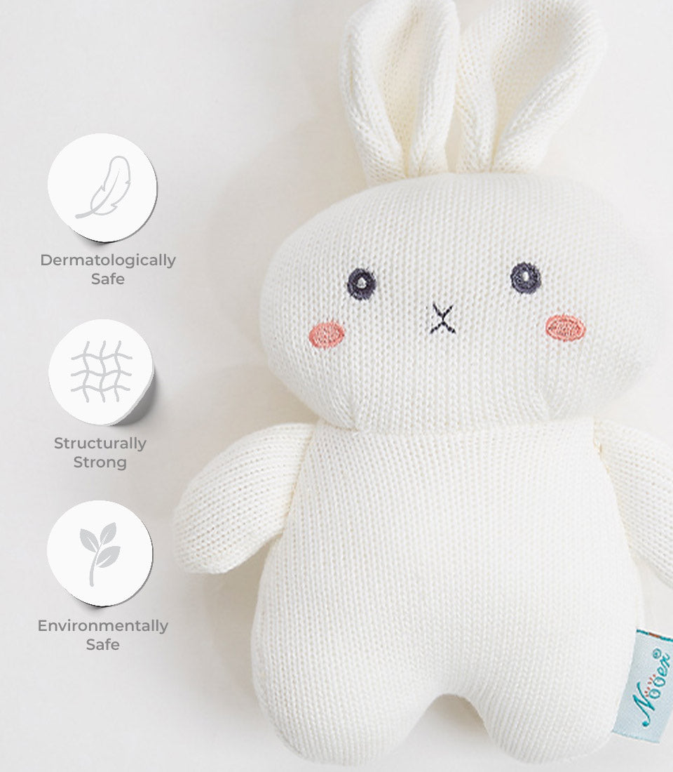 Soft white knitted bunny plush toy with embroidered face for babies and toddlers
