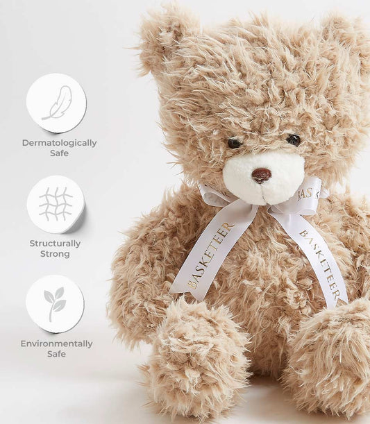 Light brown cuddly teddy bear with white snout and satin ribbon bow, dermatologically safe soft toy for kids