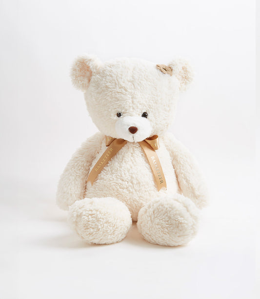 Soft cream teddy bear with satin ribbon bow for children and gift giving