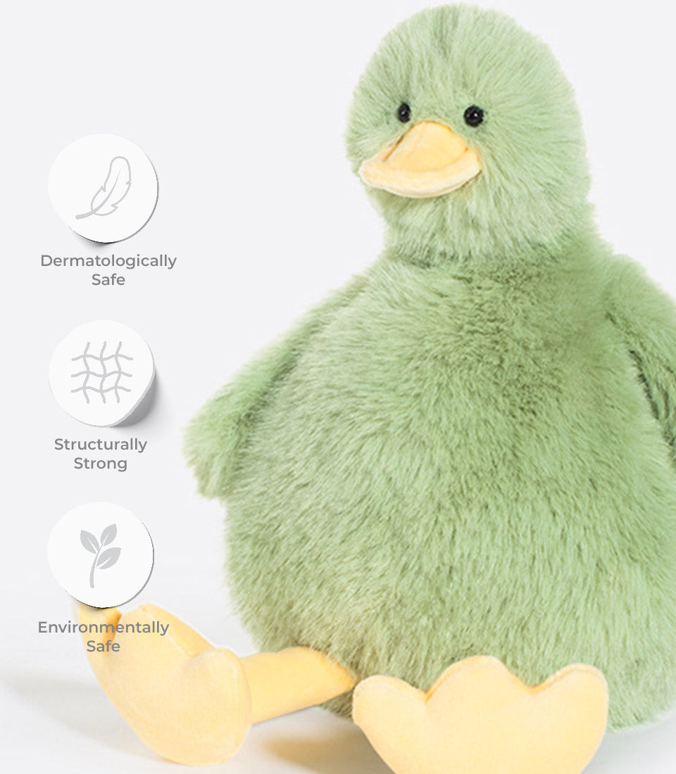 Soft pastel green plush duck toy with yellow beak, dermatologically safe and environmentally friendly for babies and kids