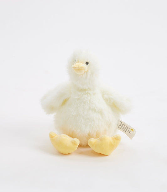 Fluffy yellow duck plush toy with soft white fur and webbed feet, ideal baby gift
