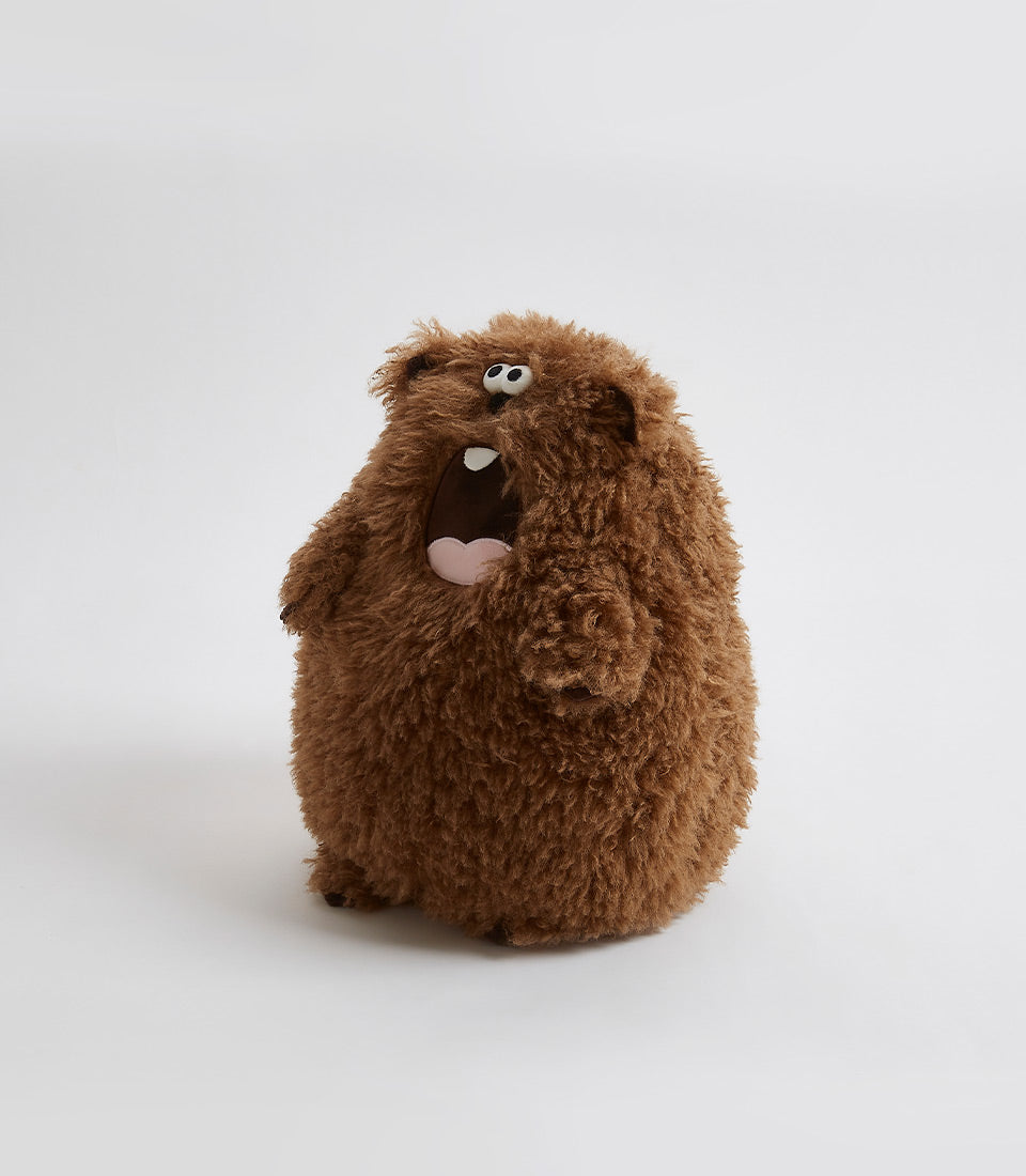 Shaggy brown plush bear soft toy with black eyes and pink tongue for kids