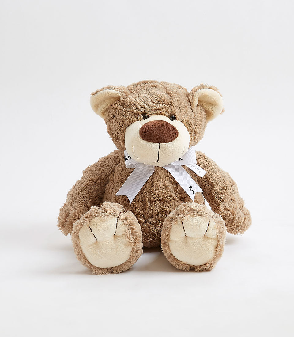 Soft brown plush teddy bear with white ribbon bow, perfect for babies and kids gifts