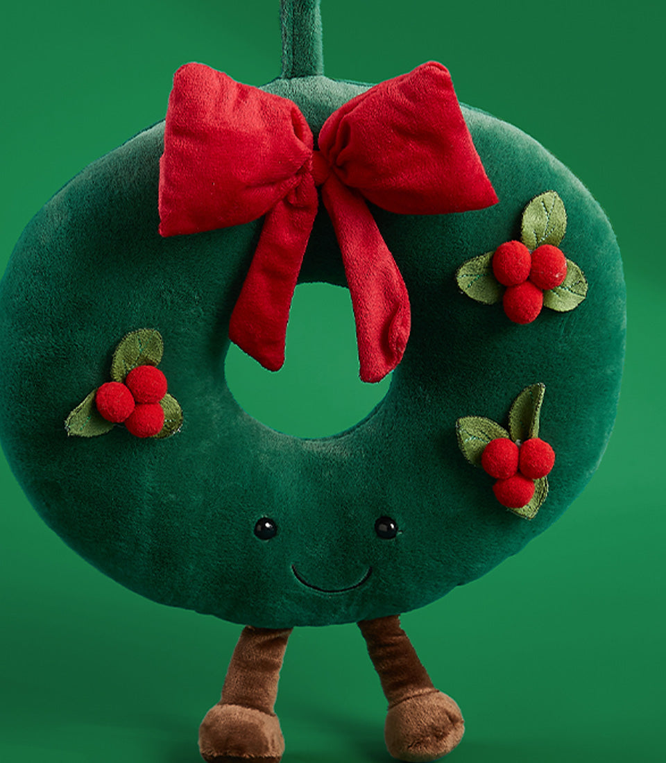 Soft green plush Christmas wreath toy with red bow and berry details, festive Basketeer gift for holiday decor