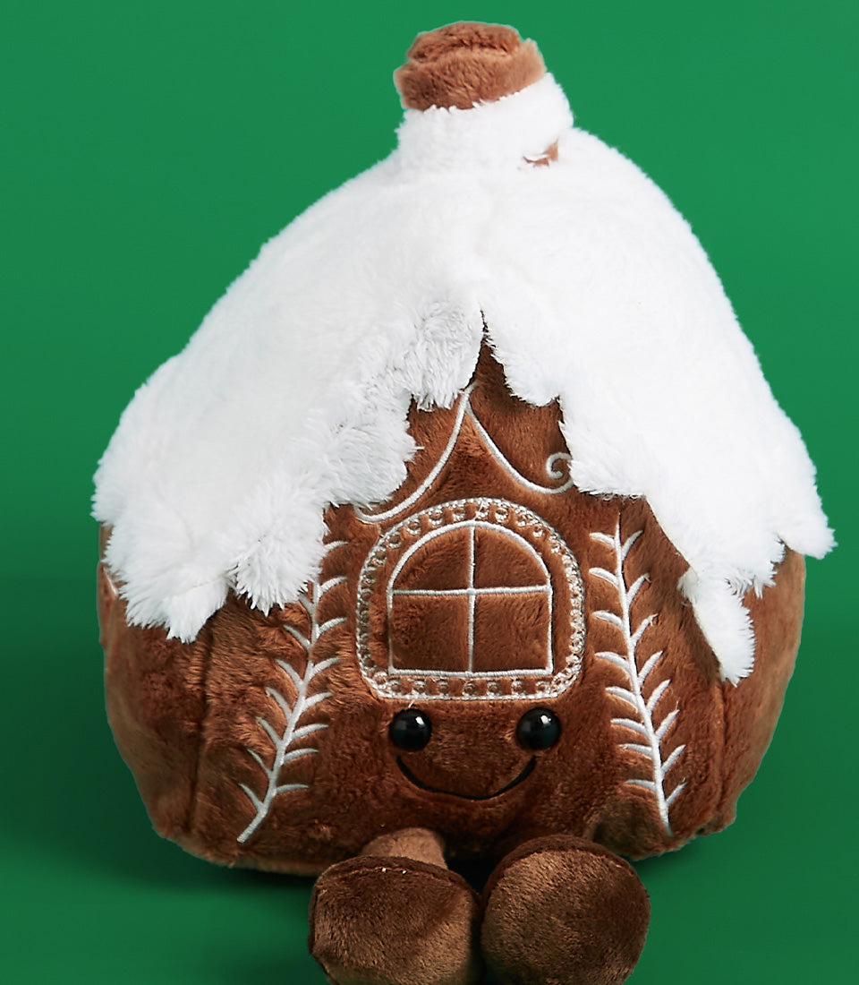 Snowy gingerbread house plush toy with embroidered window and smiling face, perfect Christmas gift