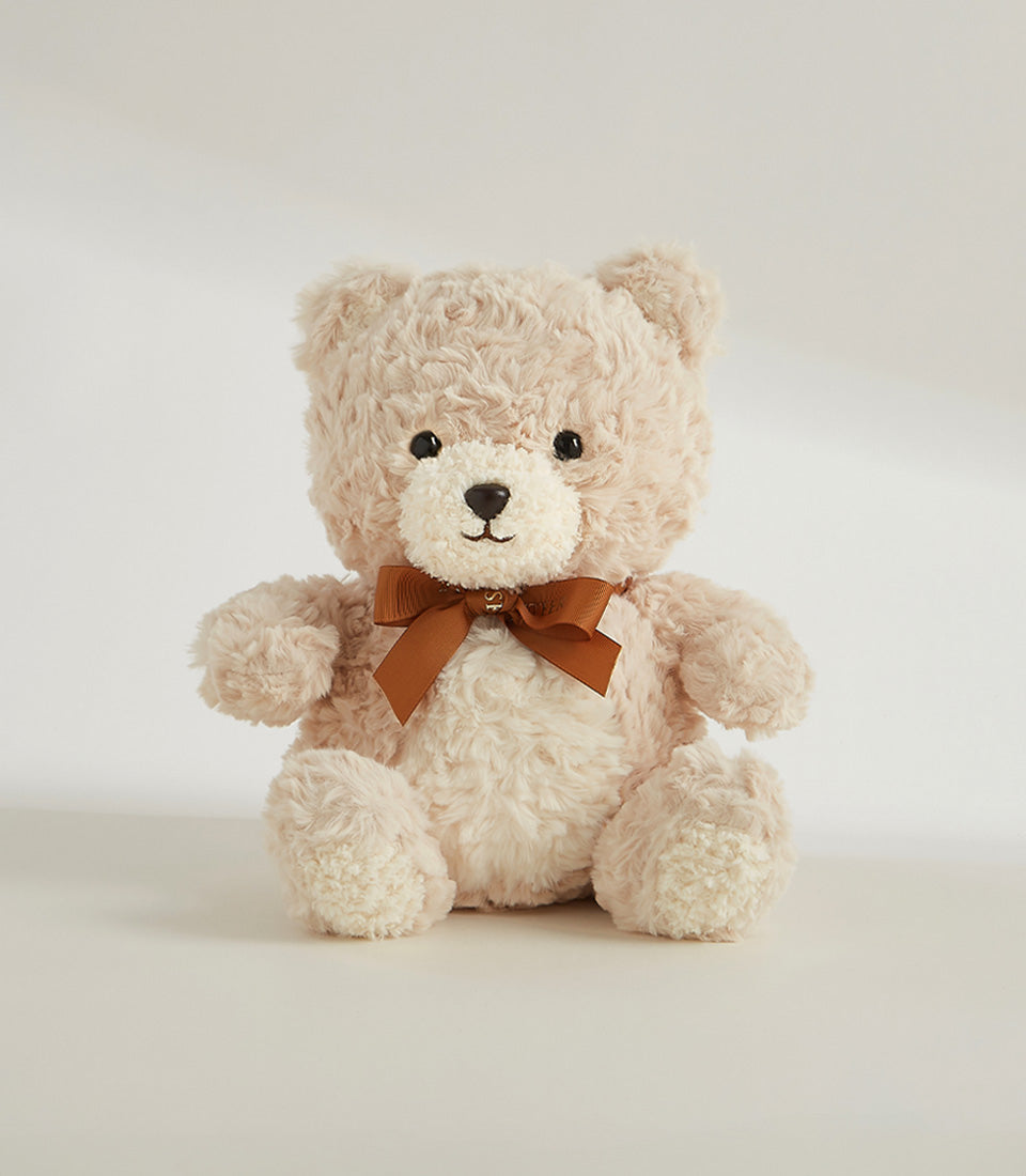 Cream plush teddy bear with satin ribbon bow, perfect gift add-on for luxury hampers and flower arrangements