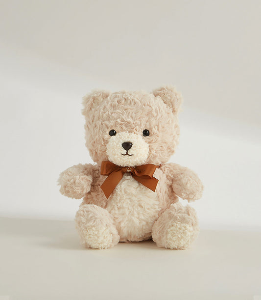 Soft, caramel-colored teddy bear with a brown ribbon. A charming add-on to your Basketeer luxury gift basket Bangkok.