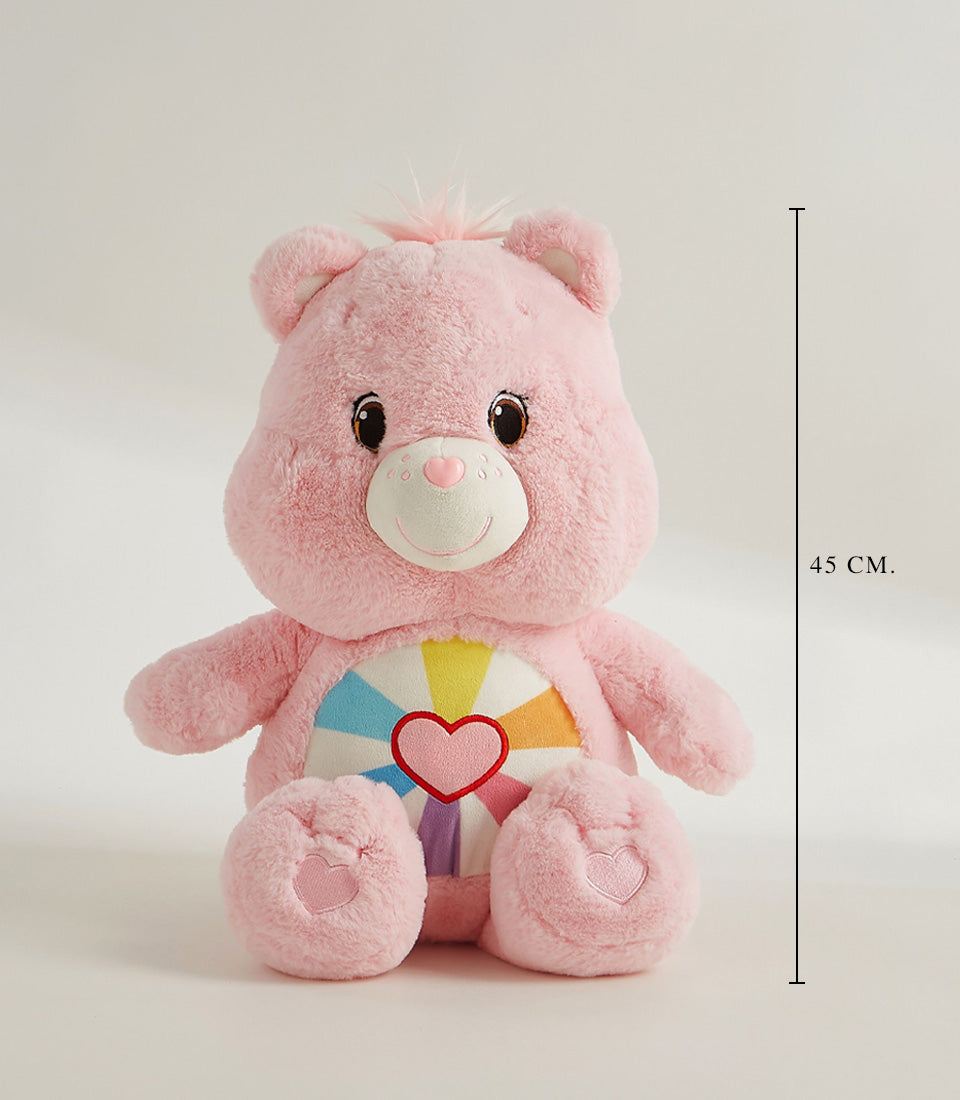 Pink plush Care Bear-style toy with rainbow heart belly design, 45cm soft stuffed animal gift