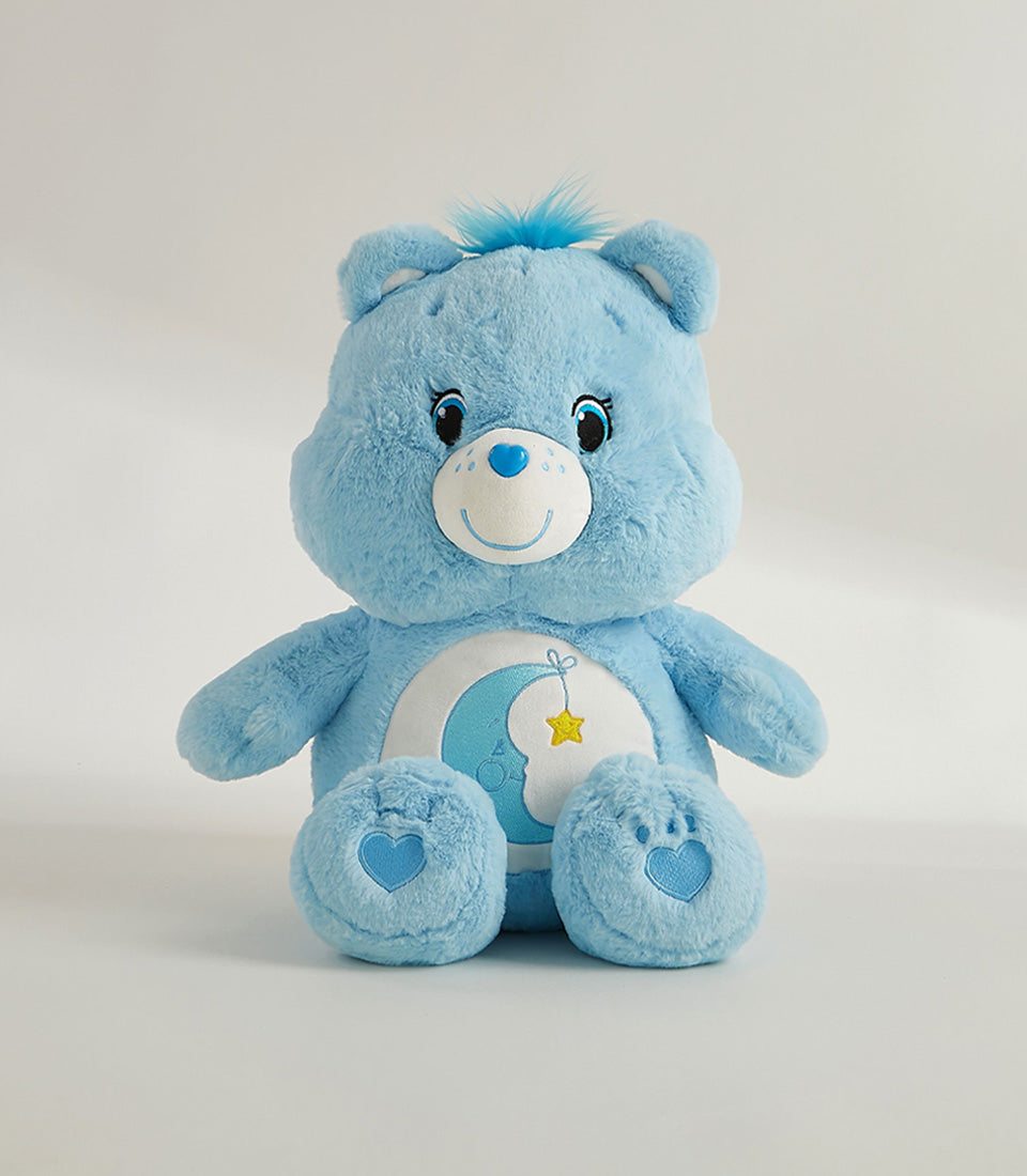 Light blue plush bear with embroidered moon, star, and heart details for cozy gifting