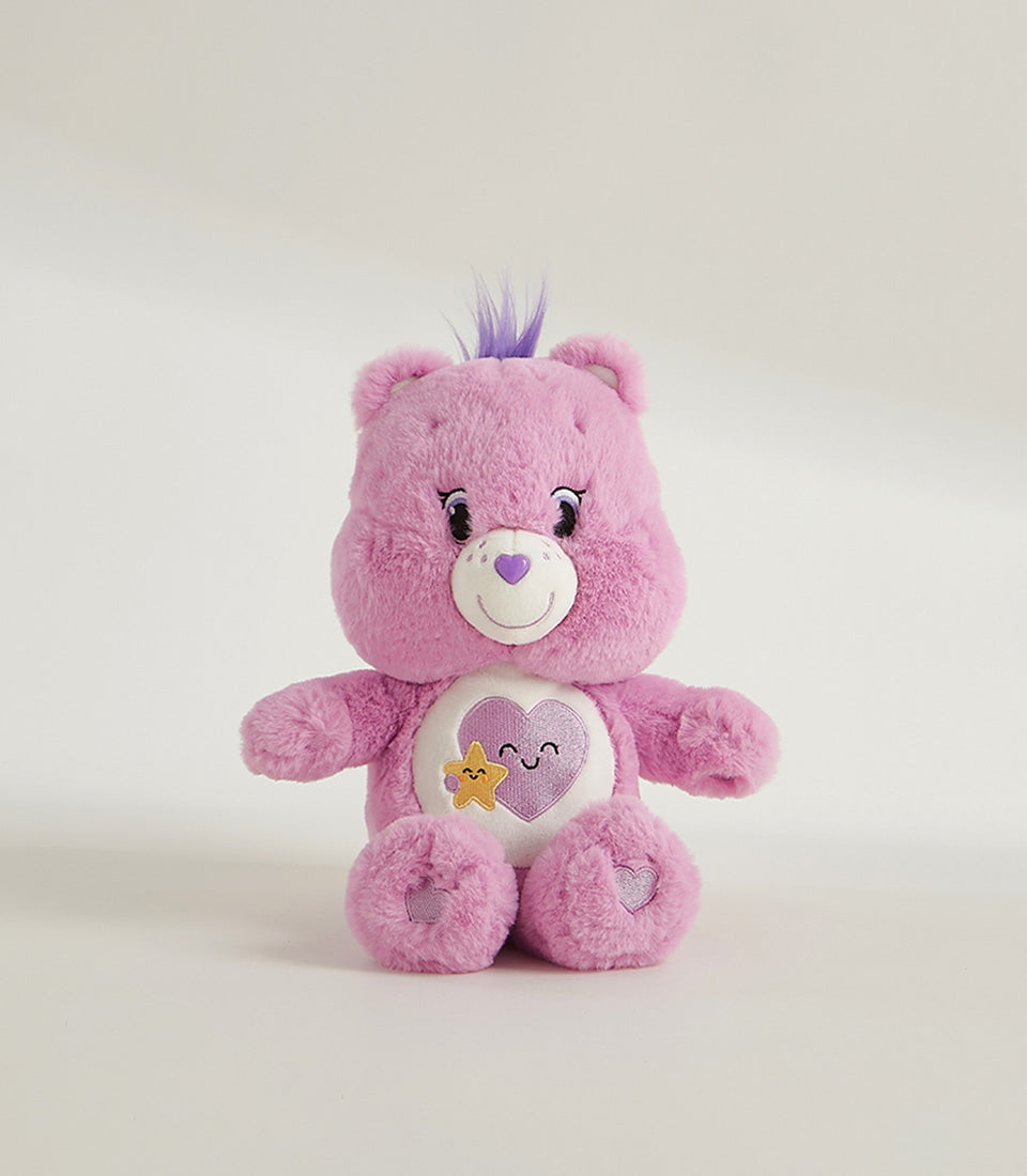 Lavender plush bear with heart embroidery and smiling face belly design, perfect for gift giving
