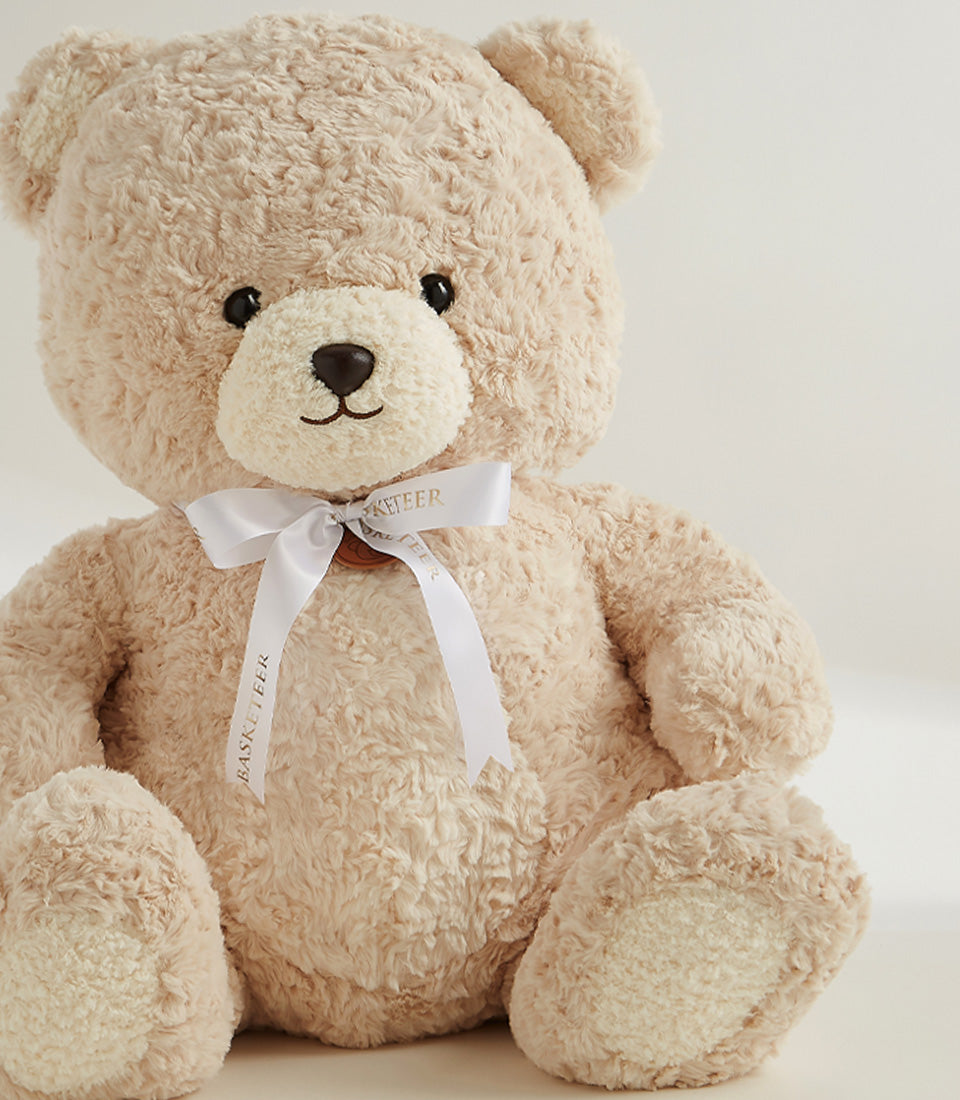 Soft cream plush teddy bear with satin ribbon bow, premium gift hamper addition