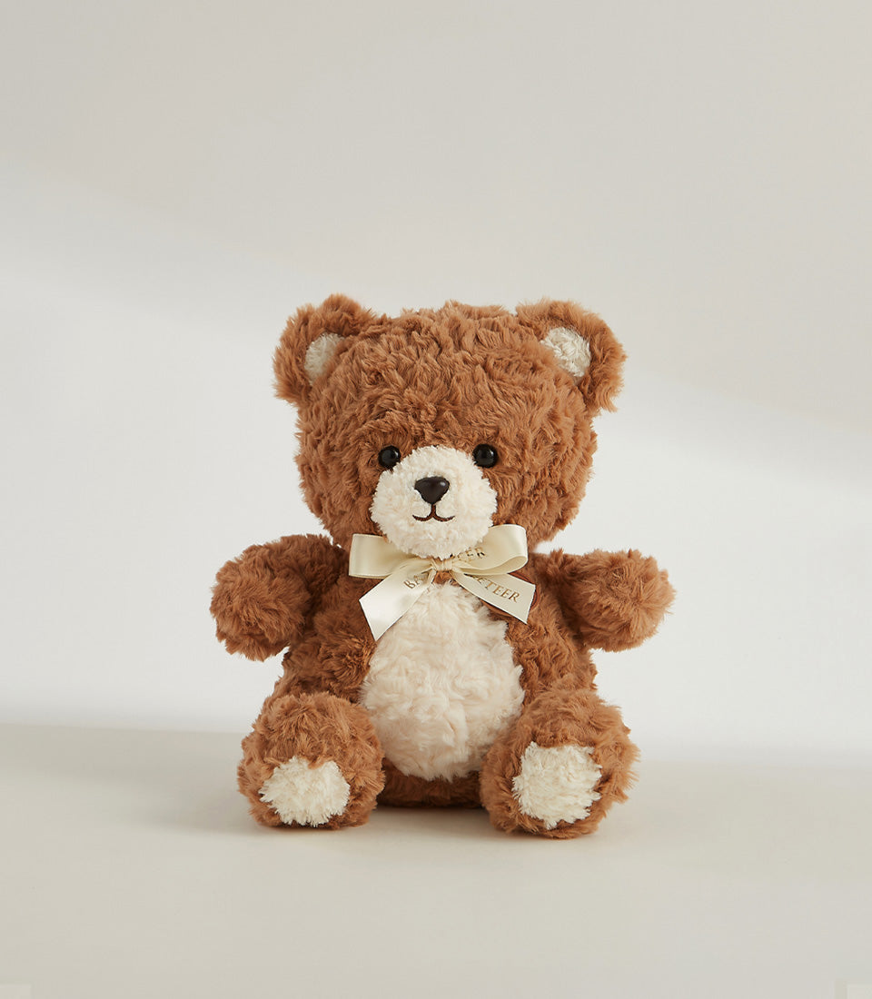 Soft brown plush teddy bear with cream accents and satin ribbon bow, 23 cm cuddly companion gift