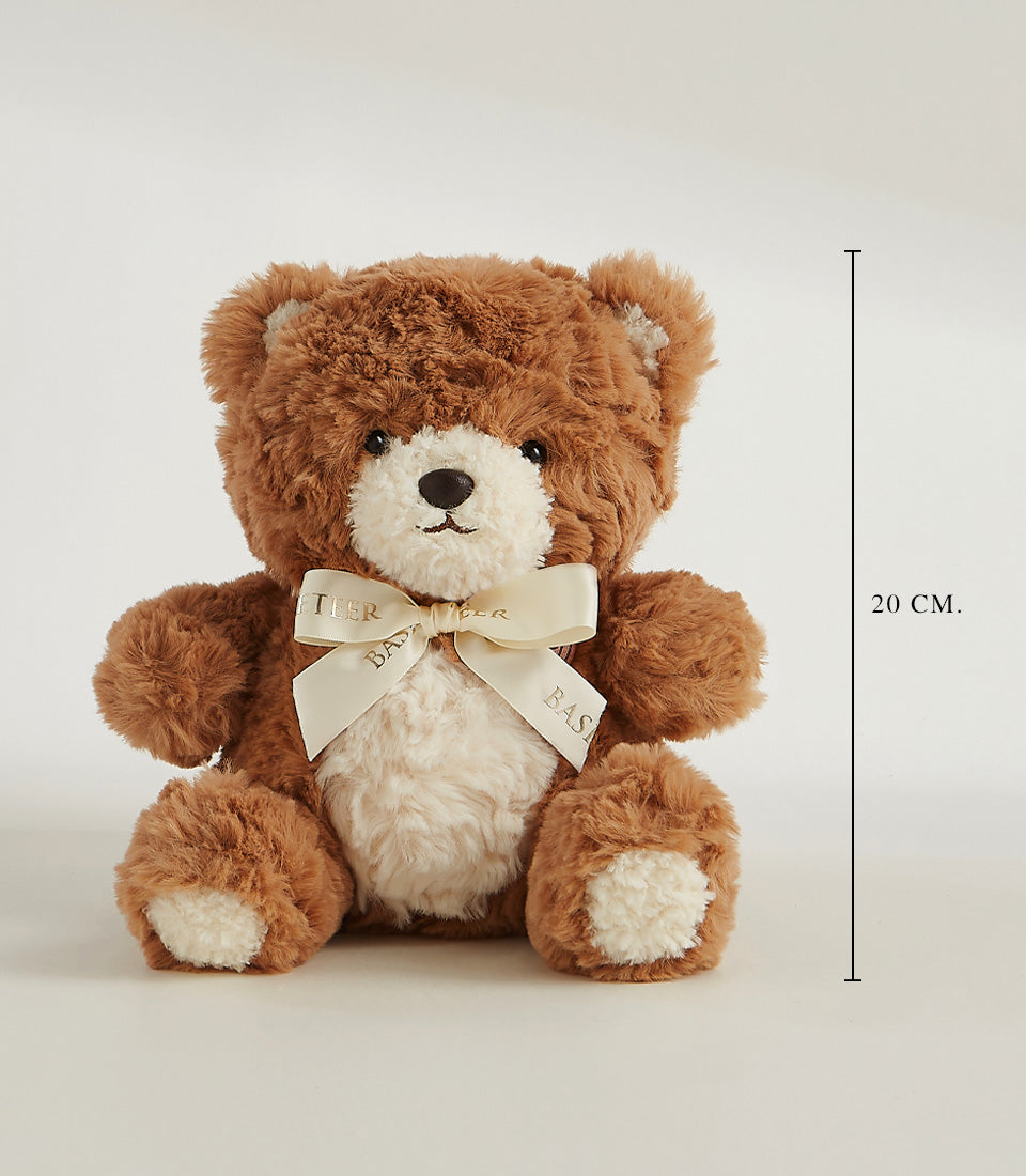 Soft brown teddy bear with cream muzzle and satin ribbon bow, perfect for gifting