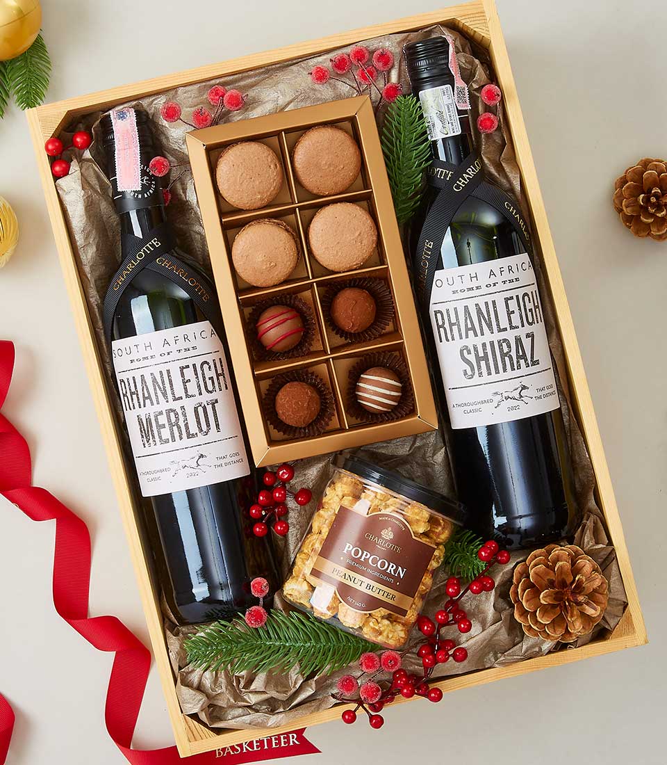 Rhanleigh Merlot and Shiraz wine gift basket with Charlotte macarons, truffles, and gourmet popcorn