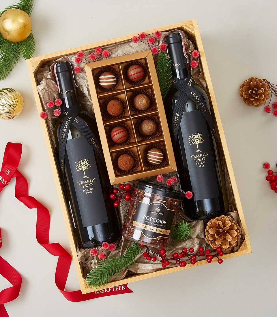 Luxury wine and chocolate gift box with two Tempus Two wine bottles, gold chocolate truffles, and chunky chocolate popcorn