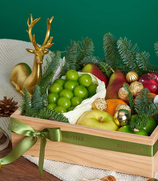 Premium wooden Christmas fruit box with Ferrero Rocher, fresh pears, apples, oranges and festive gold accents