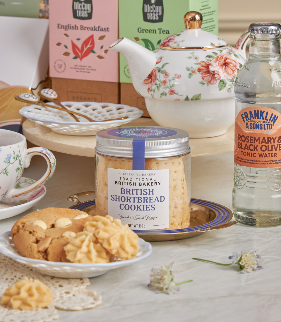 Grand Luxury High Tea gift basket with English breakfast tea, floral teapot, shortbread cookies, and tonic water for New