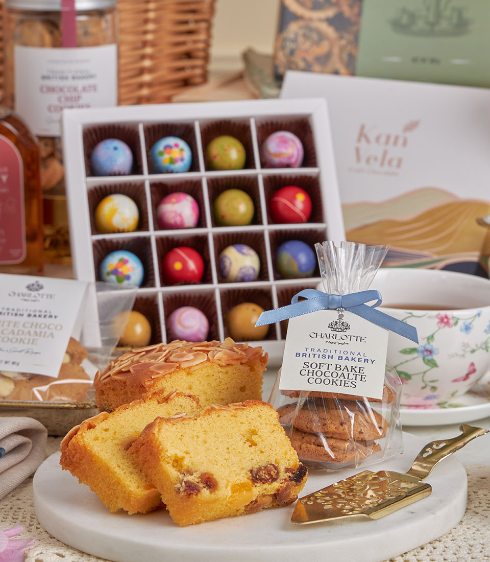 Grand Luxury High Tea gift basket with golden pound cake, soft-bake chocolate cookies, artisan truffles, and fine teacup