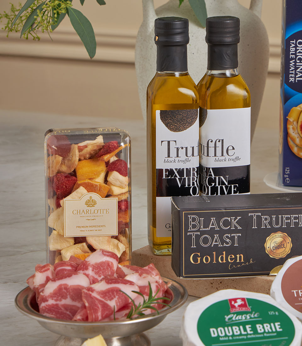 Prestige luxury gourmet gift set with truffle olive oil, artisan cheeses, cured meats, and gourmet crackers