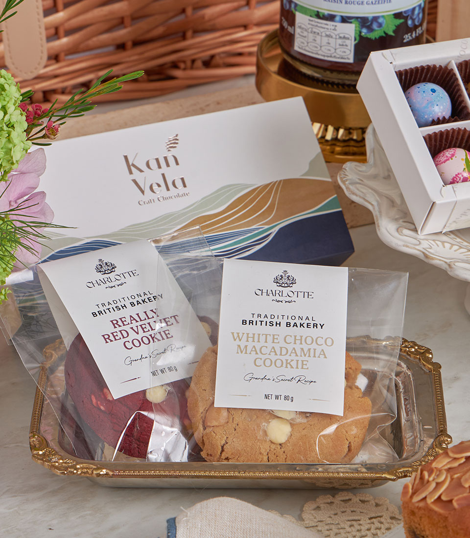 Deluxe gourmet gift set with red velvet and macadamia cookies, craft chocolate, and colorful truffles for New Year