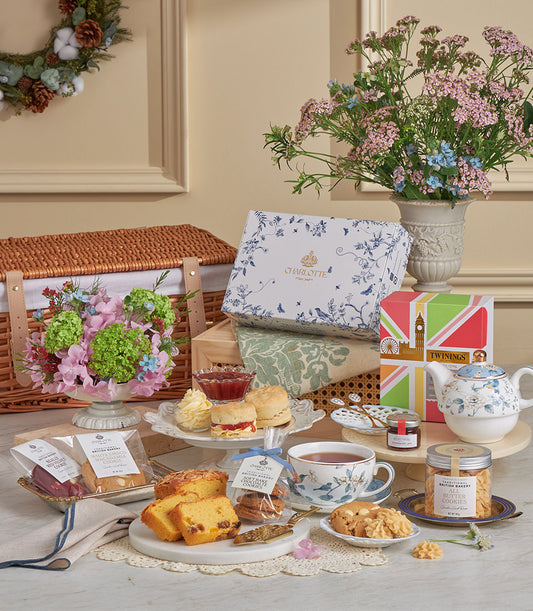 Luxury afternoon tea gift set with Charlotte bakery scones, Twinings tea, blue floral teapot and New Year celebration basket