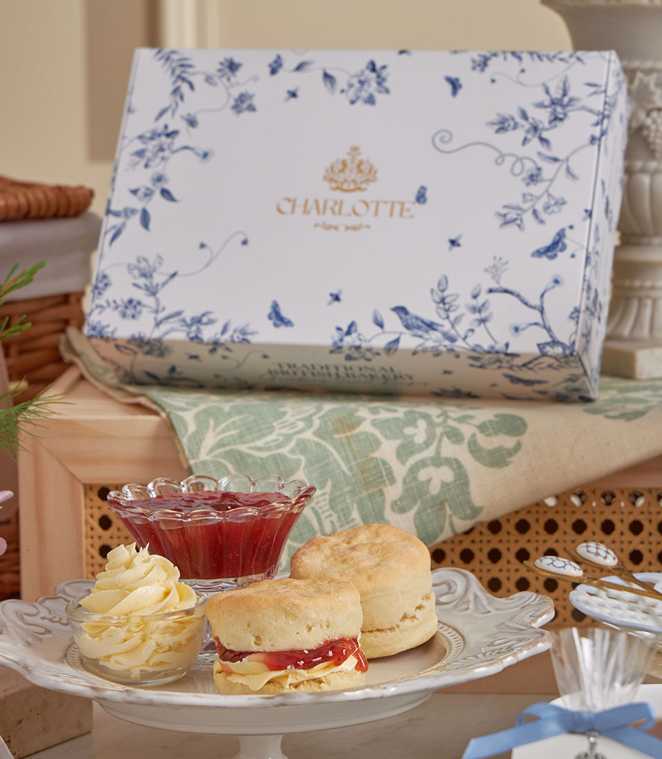 Luxury afternoon tea gift set with fresh scones, clotted cream, and strawberry jam on ornate stand, Charlotte Bakery