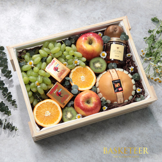 Wooden crate gift basket with fresh fruit, raw honey, and gourmet treats, artisan gourmet hamper for health-conscious gifting