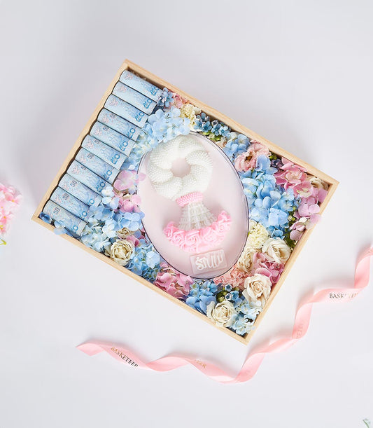 Luxe Mother's Day gift basket with cash, pink and blue floral garland, and artisan pastels