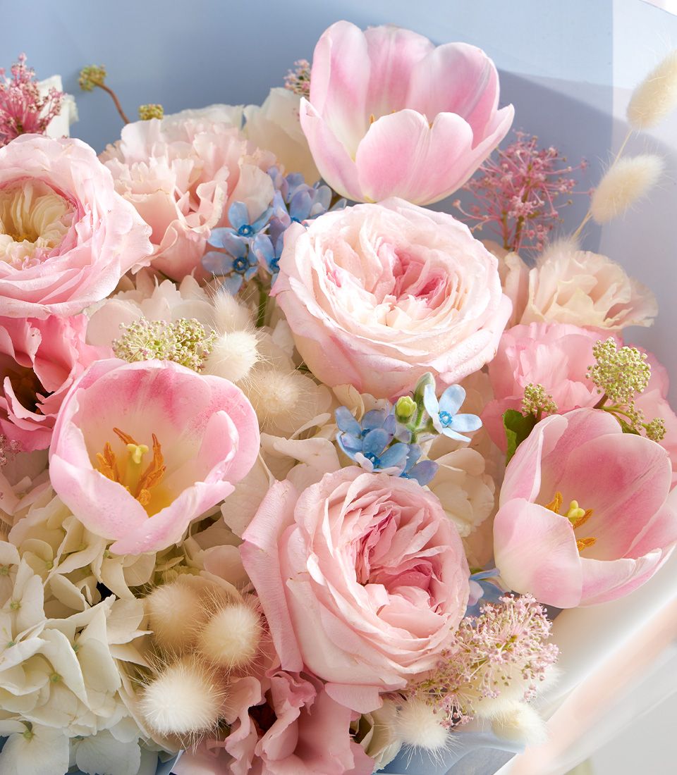 Pastel pink and white birthday flower bouquet with roses, tulips, hydrangeas, and forget-me-nots