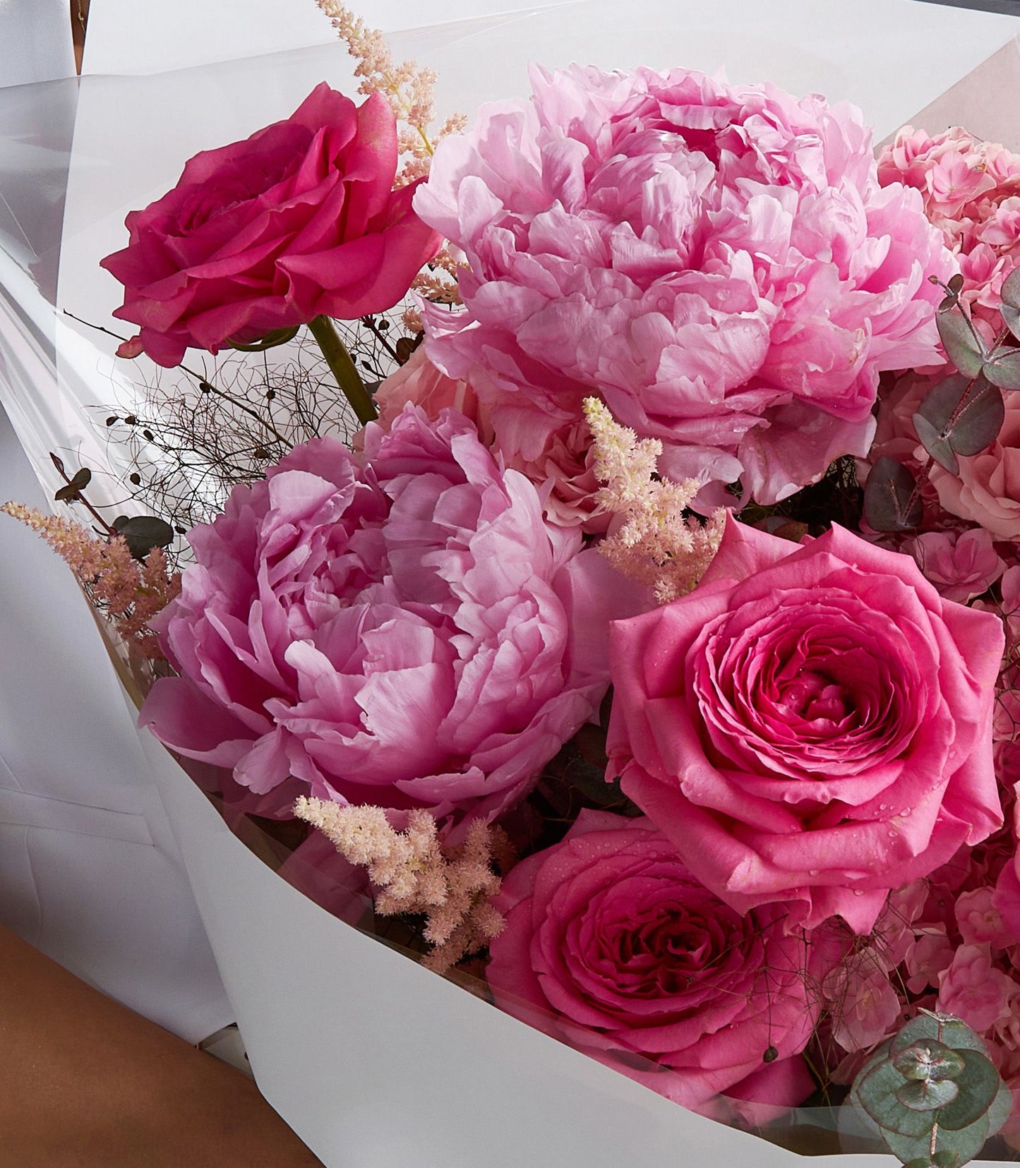 Luxury pink peony and rose bouquet with fresh Ecuador roses and delicate florals, hand-tied with elegant white wrapping