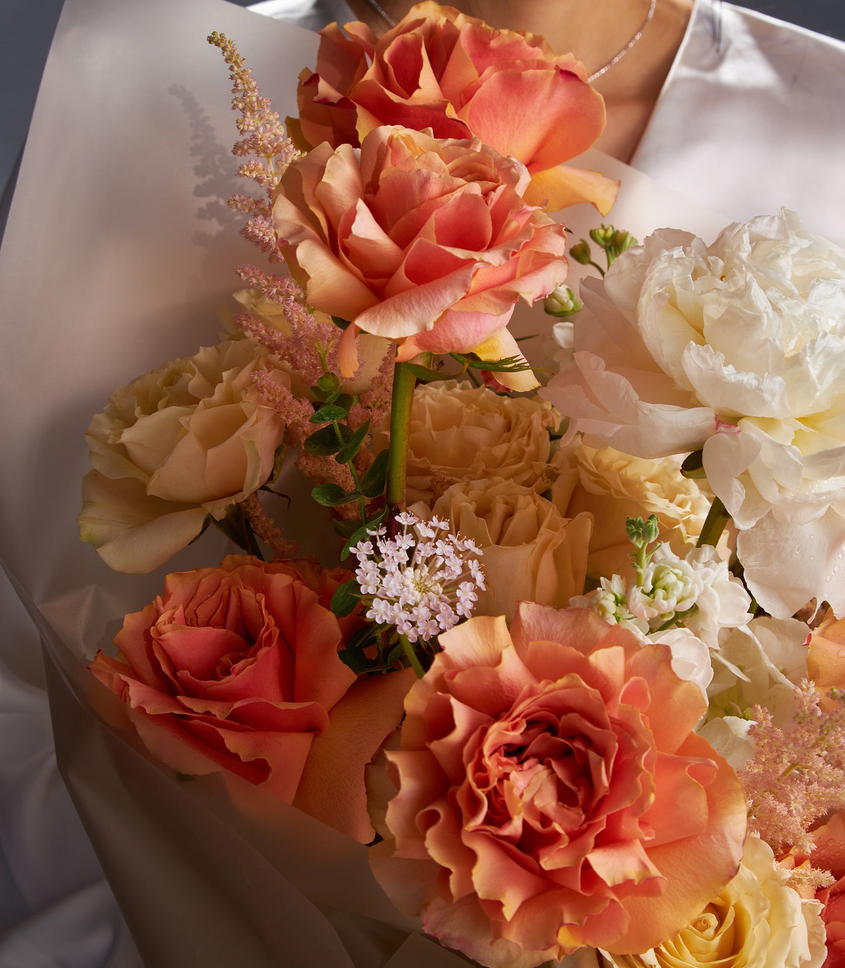 Premium peony and rose bouquet in peach, coral, and cream tones, fresh luxury flower gift