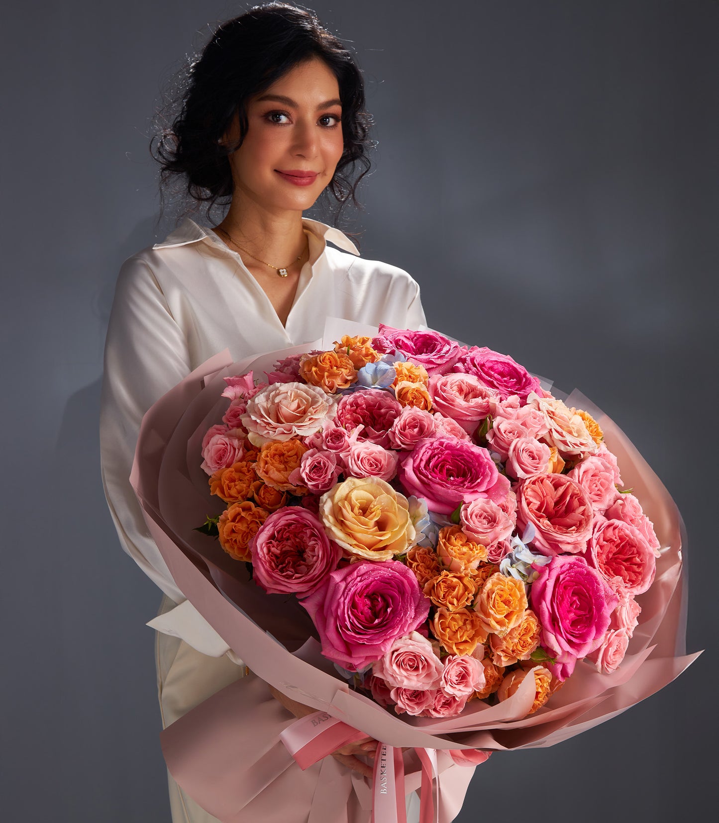 Luxury Harmony Rose Bouquet with pink, orange, and yellow roses in layered gift wrap, perfect for anniversaries